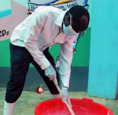 CFK Executive Director Hillary Omala making soap in Kibera