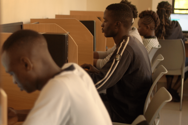7448A95F-1216-4871-B622-82ADF3DBDAF6 Youth learning computer skills at CFK’s ICT Centre, located within the Young Health and Wellness Centre (Photo Credit, CFK).